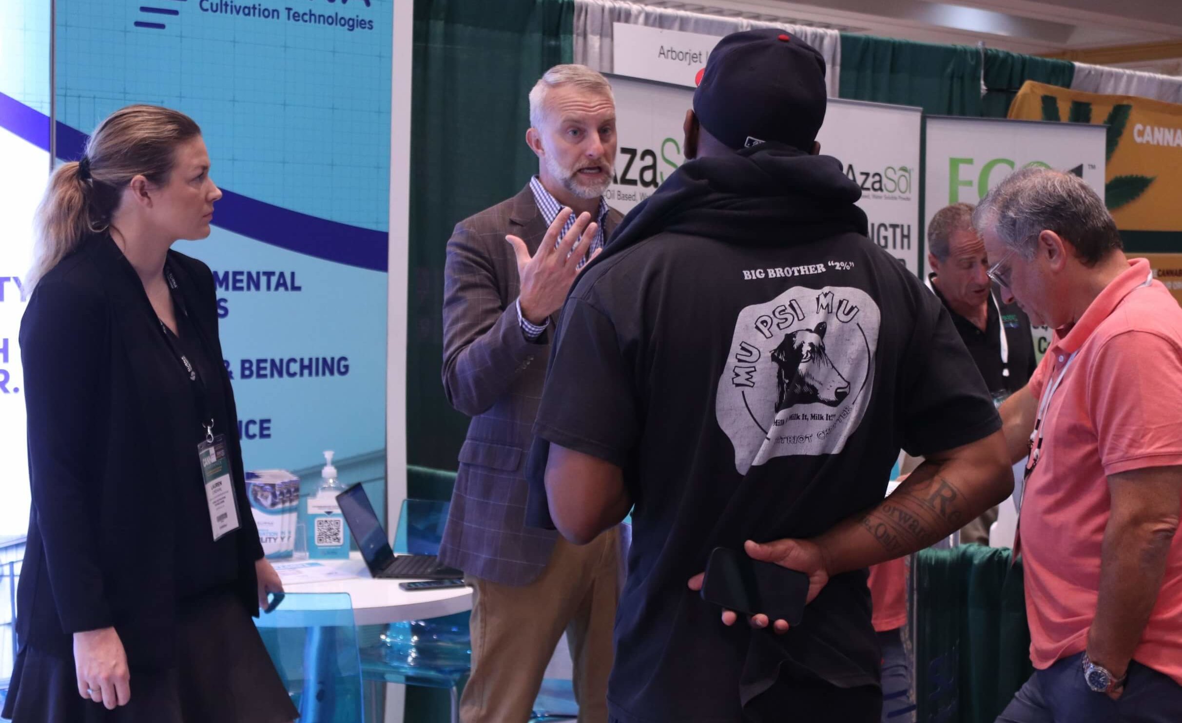 surna team talks to attendees at cannabis conference